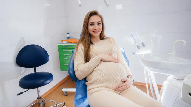 Pregnant person sitting in a dental chair