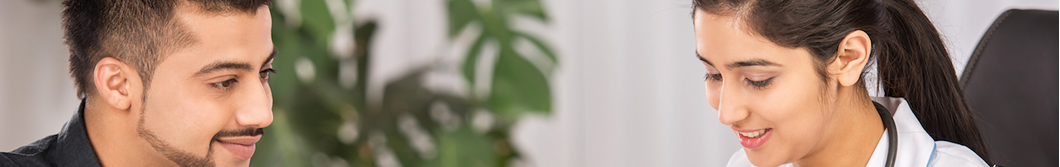 A banner of a doctor consulting with a patient in her office