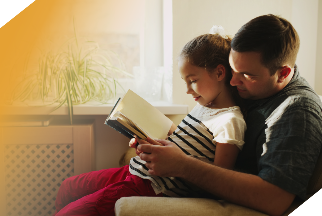 Adult and child reading a book