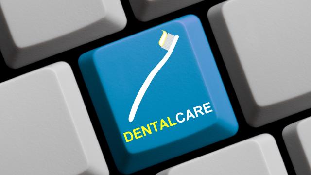 Dental care with a toothbrush on a keyboard key