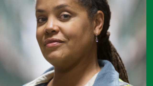 Close up of a person wearing a reflective vest