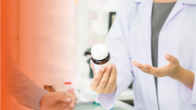 Person holding a pill bottle