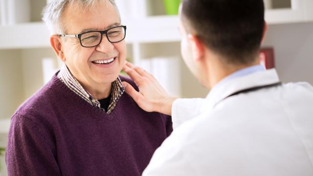 Doctor talking to a smiling older adult