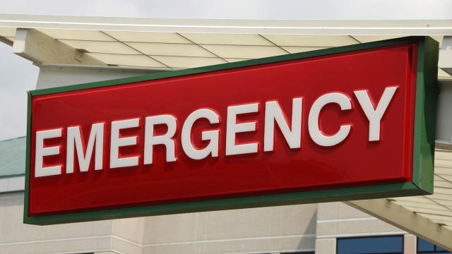 Red with green trim emergency sign outside a hospital