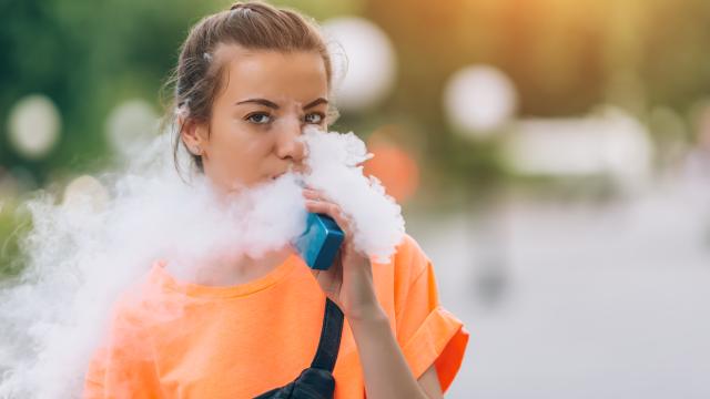Young female adult vaping