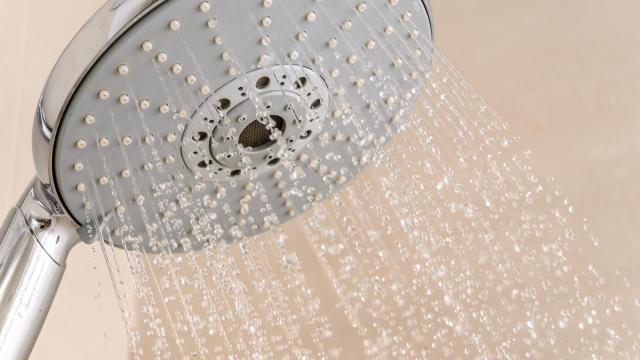 Side view of a running shower head