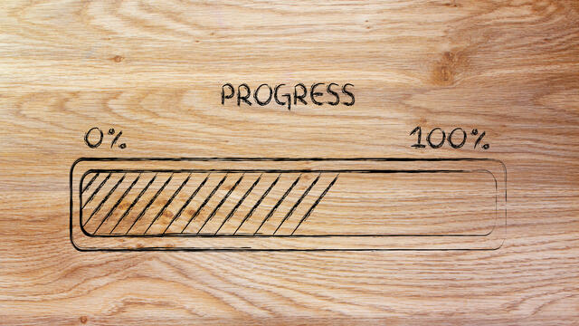 Progress bar loading imprinted on a wood.
