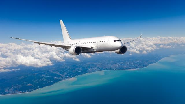 Passenger plane in flight over clouds