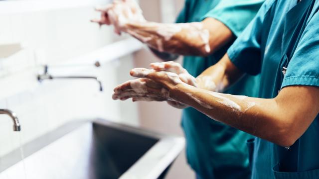 Surgeons scrubbing hands