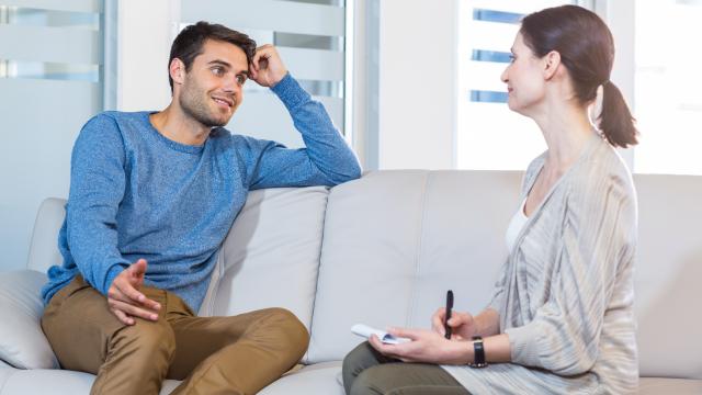 Adult on couch talking to a psychologist