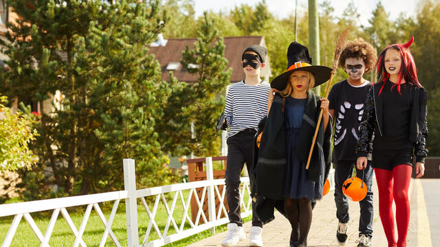 Children in Halloween costumes trick or treating