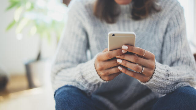 Adult using a smartphone