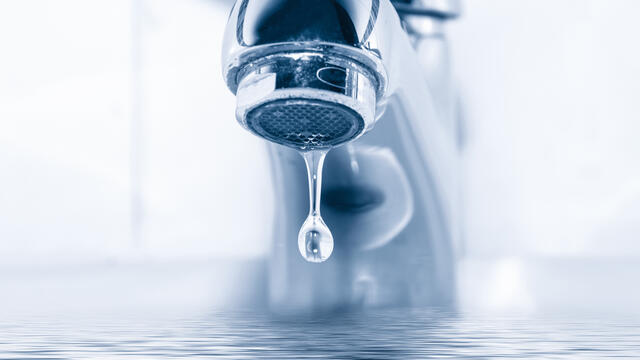 A drip of water from a faucet.