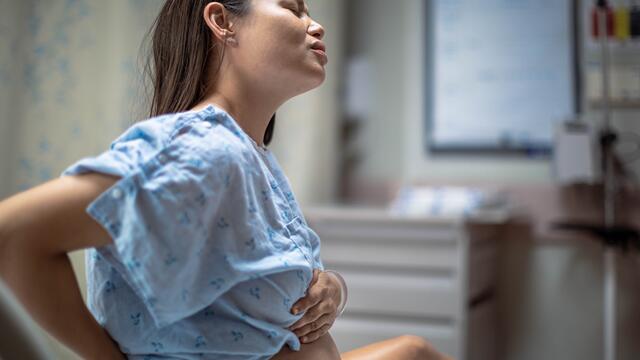 Pregnant adult in a hospital having labor pains