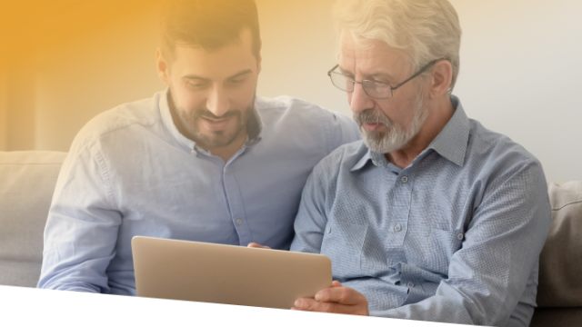 Two adults talking about what they see on a computer screen