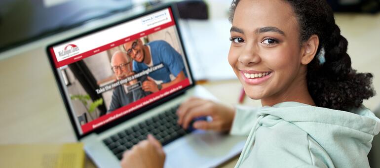 Potential student looking WisCaregiver.com on their laptop learning how to become a Certified Direct Care Professional