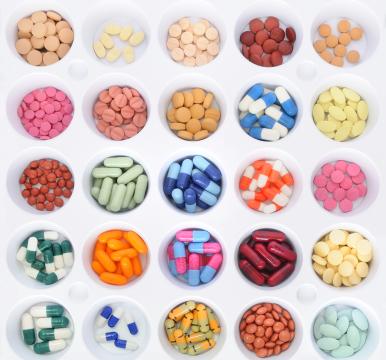 Tray of different colored drugs in capsule and pill form