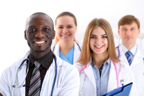Four smiling doctors