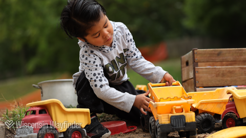Wisconsin Wayfinder: Child Plays With Toy Truck