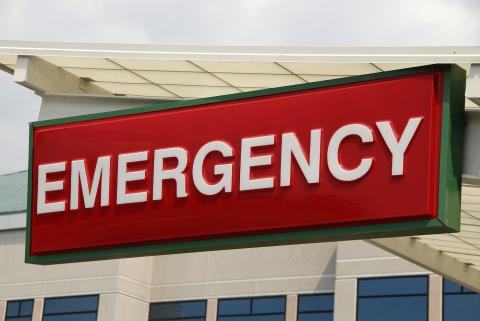 Red with green trim emergency sign outside a hospital