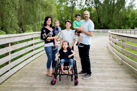 Family on a wooden path