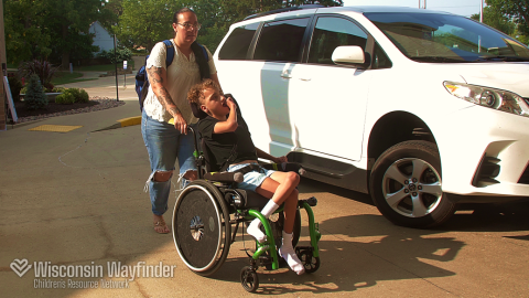Wisconsin Wayfinder: Parent Pushes Child in Wheelchair