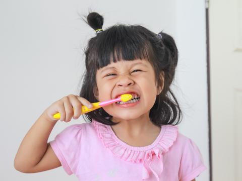 Child brushing teeth