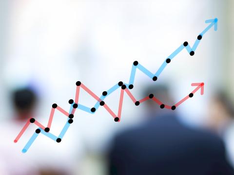 Line graph representing data trends with blurred people in background