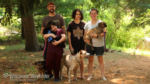 Wisconsin Wayfinder: Family of Four Holds Dogs
