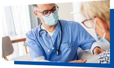 Medical professional with mask wearing patient