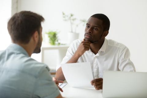 Two adults meeting in an office