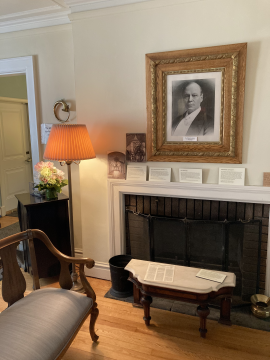 Seating area around a fireplace at the Julaine Farrow Museum