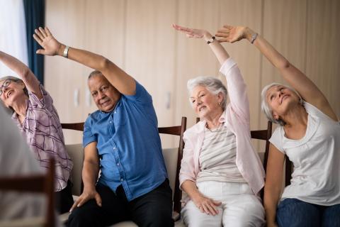 Older adults sitting and stretching