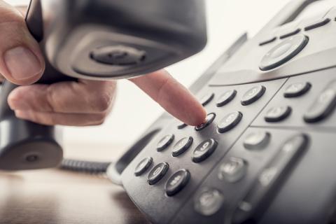 Hand dialing a pushbutton phone