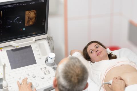 Pregnant adult receiving an ultrasound