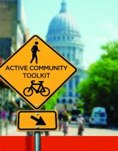 Active Community Toolkit publication cover showing the Wisconsin State Capitol building in the background with a street sign reading: Active Community Toolkit.
