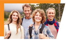 Four adults standing outdoors