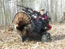 Don Christensen riding on an adapted vehicle while hunting.