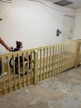 Child in wheelchair using the ramp into a home