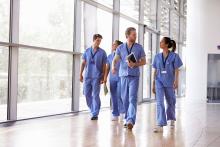medical professionals walking down a corridor